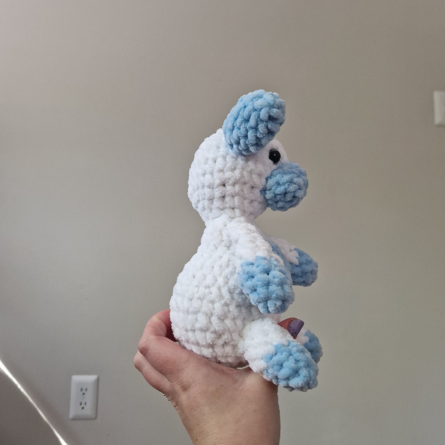Blue and white sitting cow crochet plushie