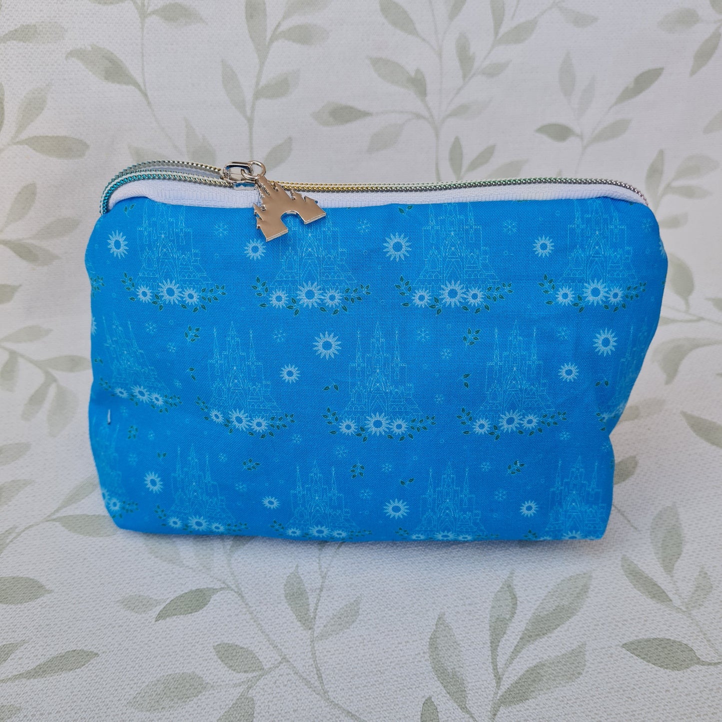 Floral Ice Palace lined triangle cosmetic bag with zipper pull