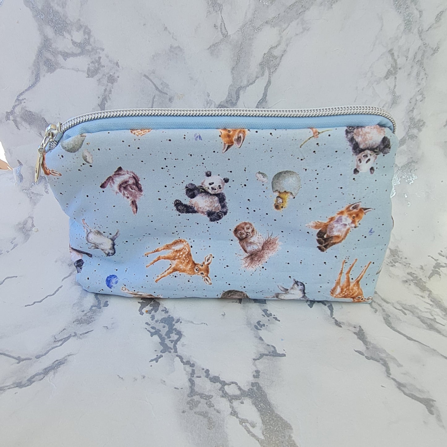 Animal lined triangle cosmetic bag with zipper