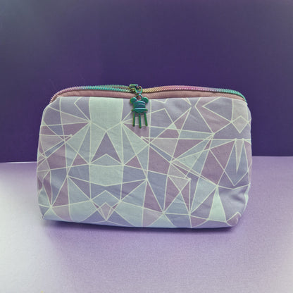 Purple Wall lined triangle cosmetic bag with water tower zipper pull