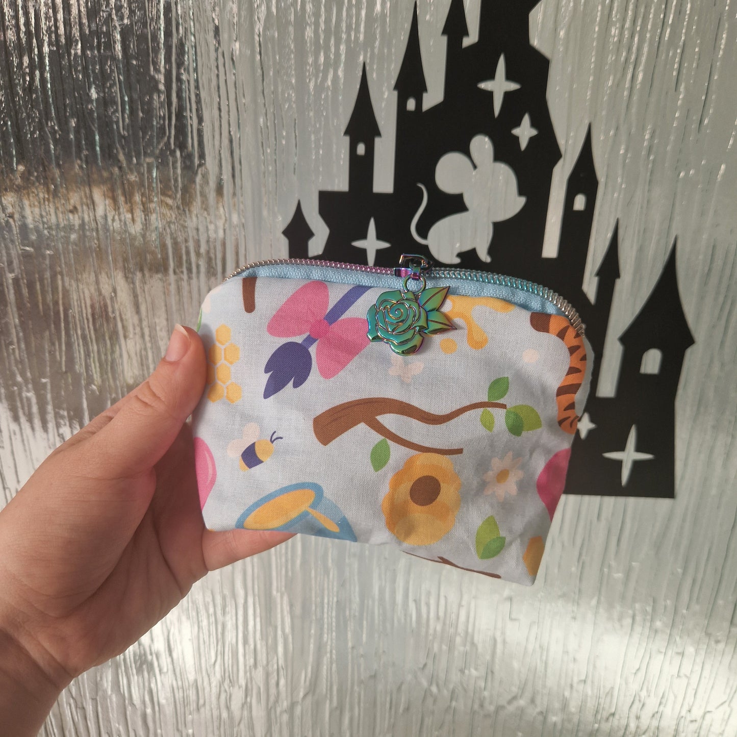 Blue 100 Acre Wood mini triangle shaped pouch cosmetic bag with rose zipper pull