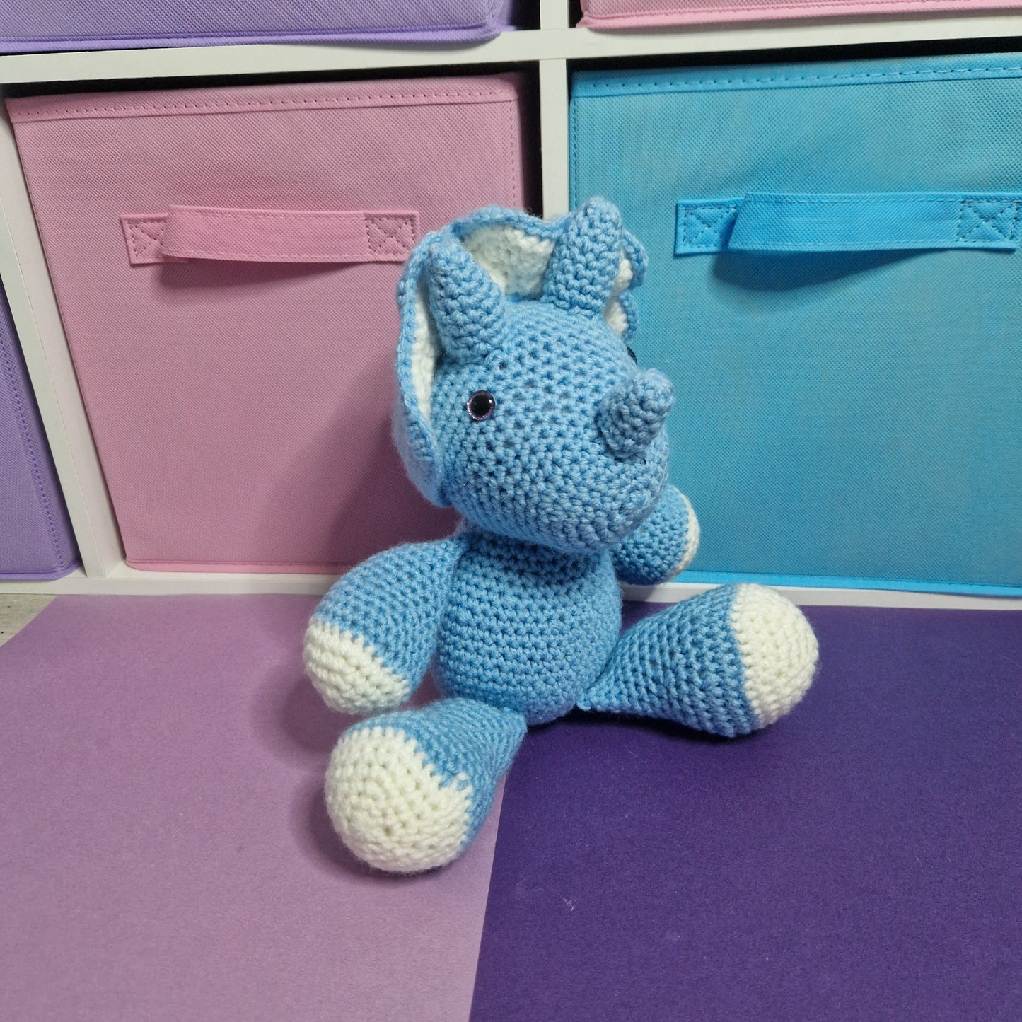 Blue and grey crochet dinosaur