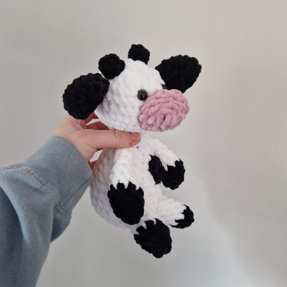 Black and white sitting cow crochet plushie