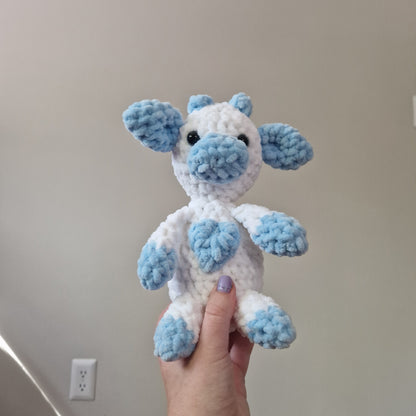 Blue and white sitting cow crochet plushie