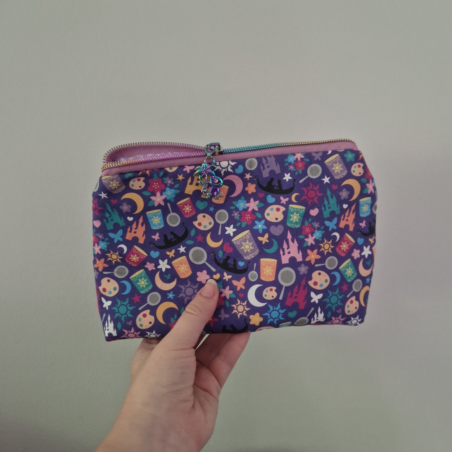 The Lost Princess  themed lined triangle cosmetic bag with matching zipper pull