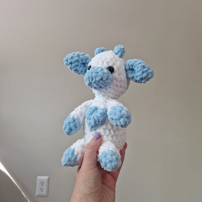 Blue and white sitting cow crochet plushie