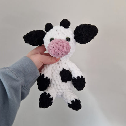 Black and white sitting cow crochet plushie