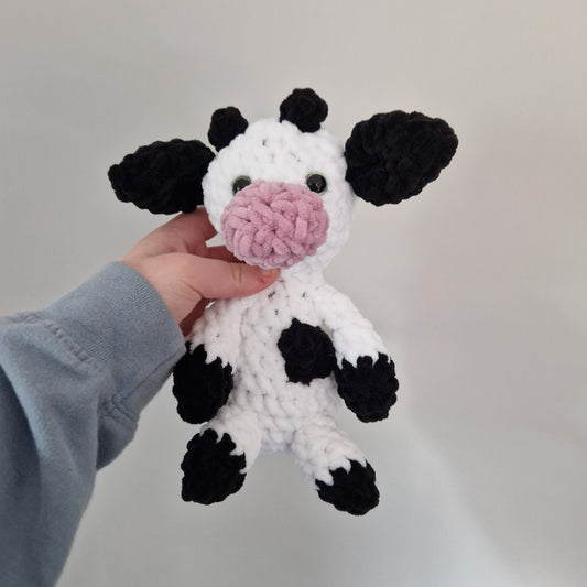 Black and white sitting cow crochet plushie