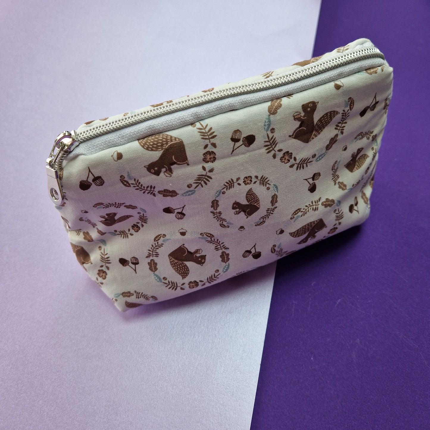 Squirrel lined triangle cosmetic bag with zipper